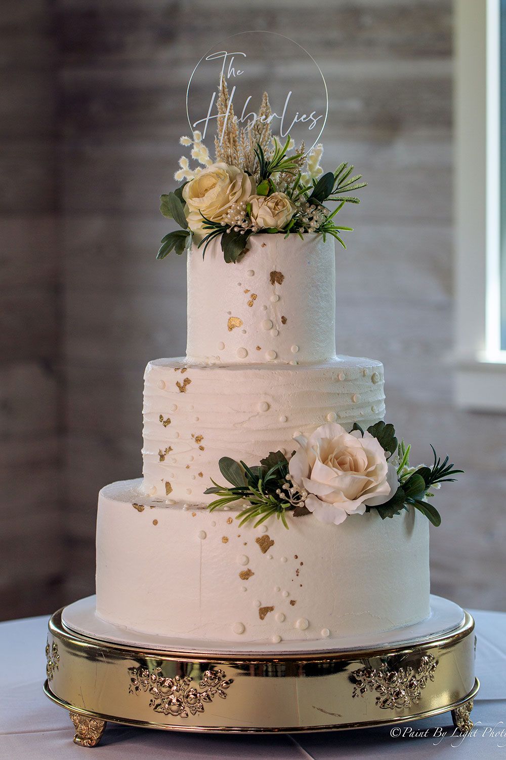 Elegant Buttercream Wedding Cake with Gold Foil Accents