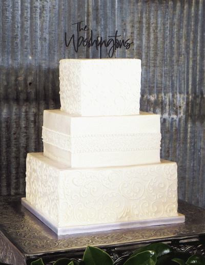 3 Tier square embossed wedding cake with Hot pink - CakesDecor